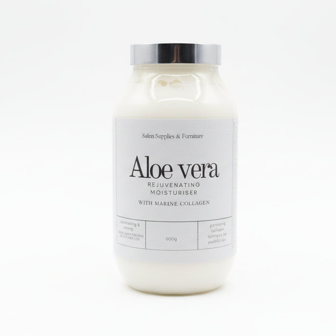 Bottle of aloe vera moisturizer with marine collagen on a desk with a blurred office background