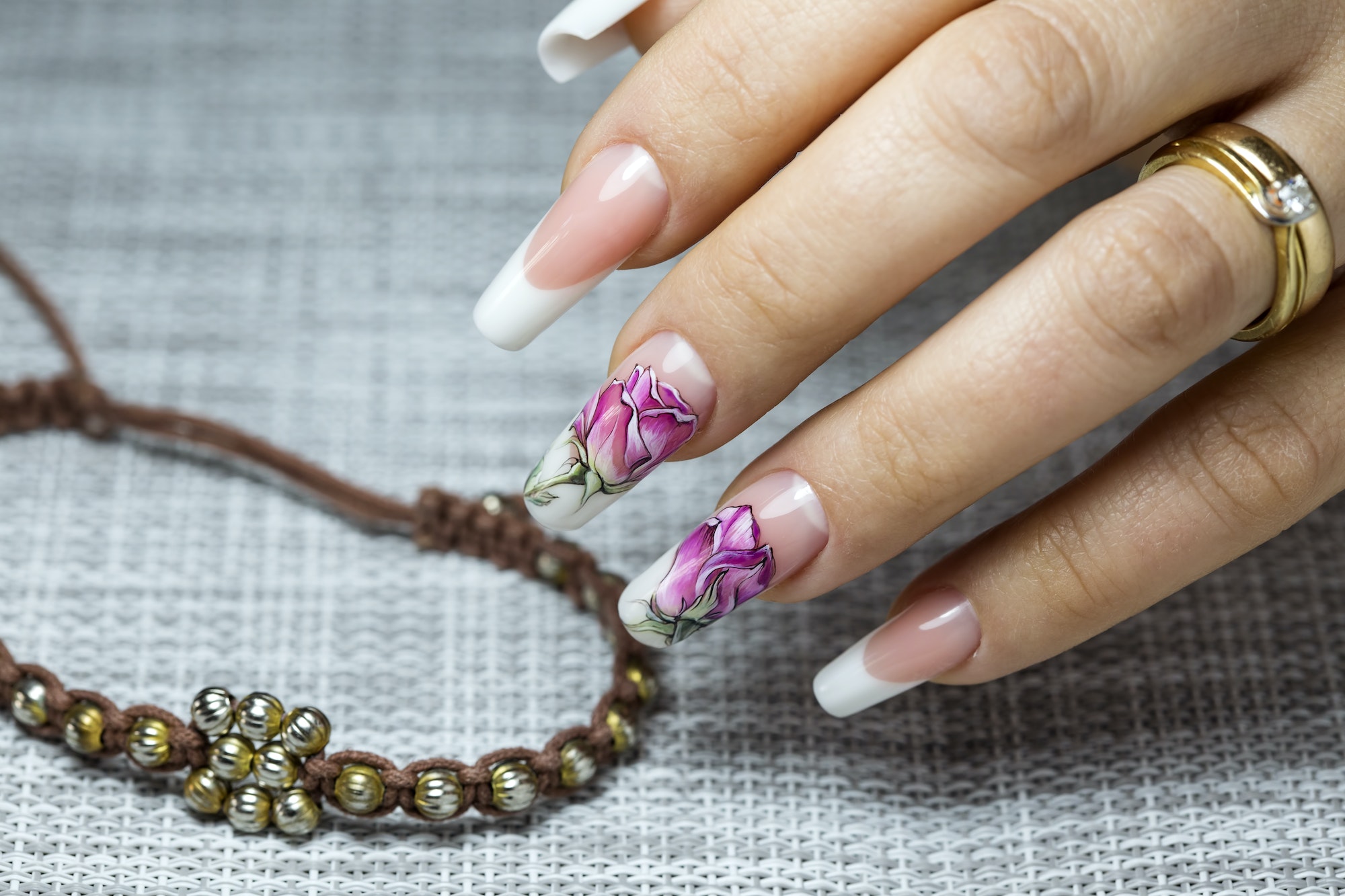 flowers on a transparent lacquer on the nails